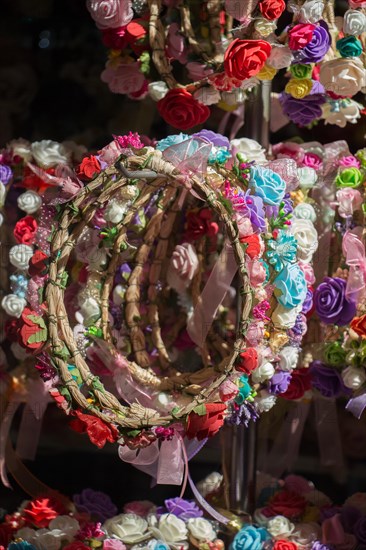 Colorful crowns for sale made of fake flowers