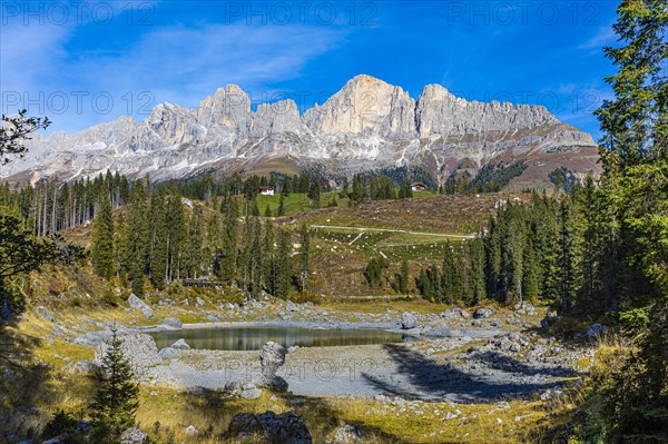 Lake Carezza, behind the peaks of the Catinaccio, Dolomites, South Tyrol, Italy, Europe