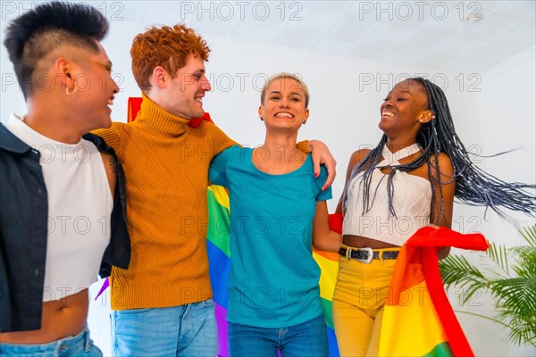 LGBT pride, lgbt rainbow flag, group of friends dancing and having fun in a house at the party