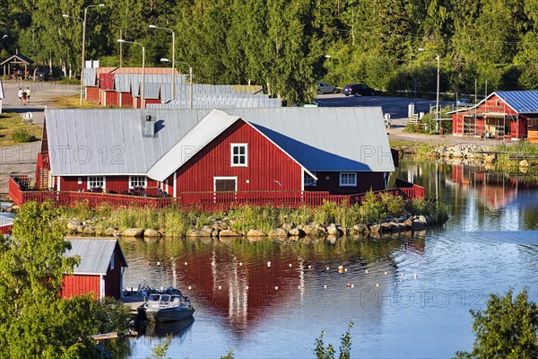 Red wooden houses in the fishing village of Svedjehamn, view from above, Bjoerkoeby, Korsholm, Mustasaari, Kvarken Archipelago Nature Reserve, UNESCO World Heritage Site, Ostrobothnia, Finland, Europe