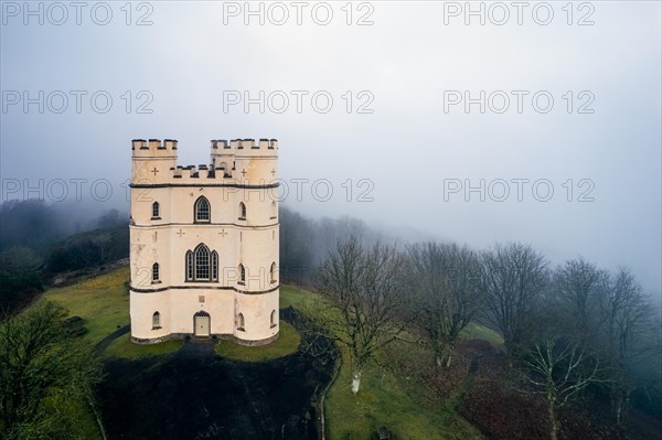 Misty morning over Haldon Belvedere from a drone, Lawrence Castle, Higher Ashton, Exeter, Devon, England, United Kingdom, Europe