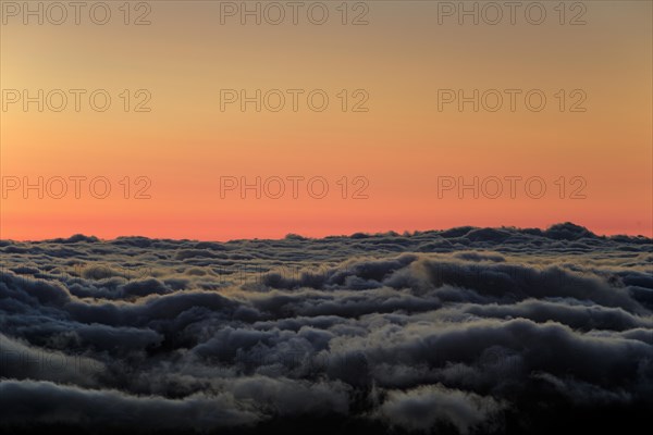Shortly in front of sunrise above trade wind clouds at an altitude of 2000 metres, Teide National Park, Tenerife, Canary Islands, Spain, Europe