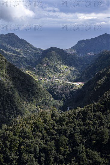 View towards the sea, Ribeira da Metade mountain valley and the central mountain range, Madeira, Portugal, Europe