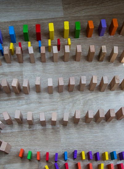 Colorful Domino Blocks in a line on a white background