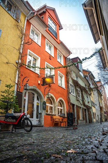 Dreamy alleyway alley with rain and colourful houses, Lindau Island, Lake Constance, Germany, Europe