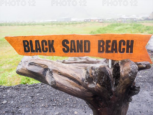 Rainy atmosphere, signpost to Reynisfjara beach, black lava beach, Vik, South Iceland, Iceland, Europe