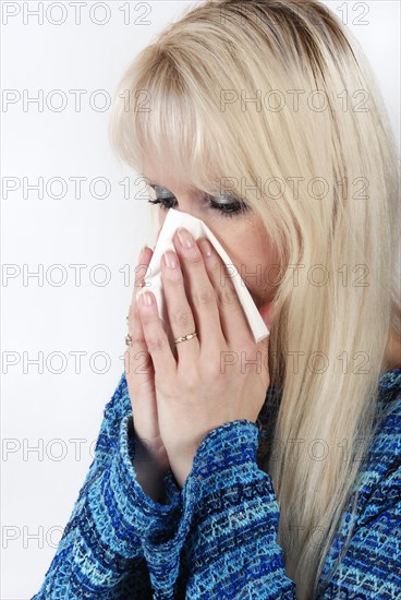 Woman sneezing