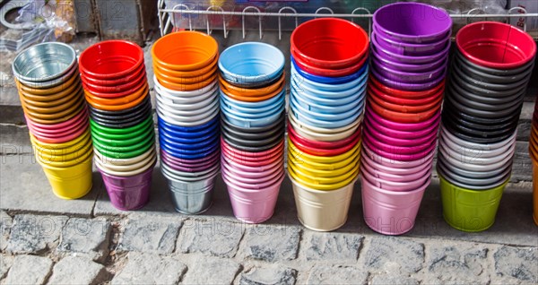 Little set of buckets of various colors in a market place