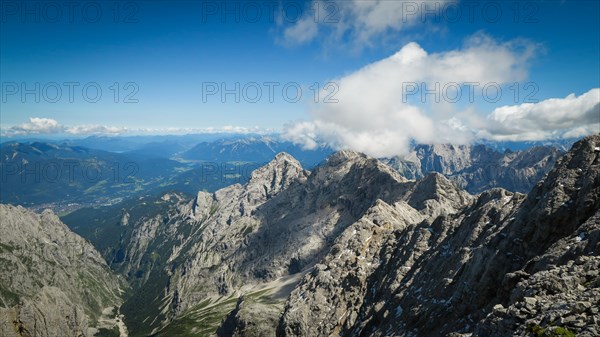 Beautiful view from the top of the surrounding peaks and the village below. Zugspitze massif in the bavarian alps, Dolomites, Italy, Europe