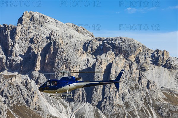 Helicopter takes off for the Dolomites tour, Val Gardena, Dolomites, South Tyrol, Italy, Europe