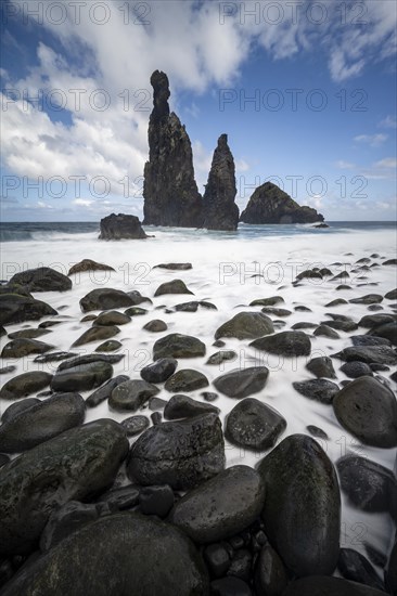 Long exposure, beach with volcanic rock, rock formation Ilheus da Rib and Ilheu da Ruama in the sea, Praia da Ribeira da Janela, Madeira, Portugal, Europe