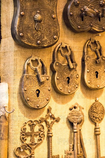 Retro styled keys and locks are hanging on a wall