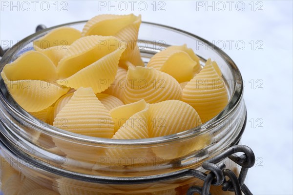 Conchiglie, shell pasta in glass container, pasta