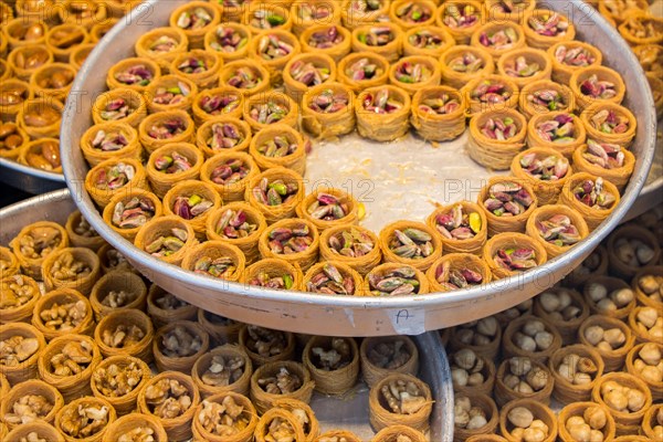 Nut stuffed dessert of mini size cuisine in hand