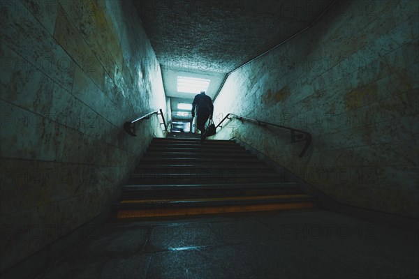 Silhouette of the man in underground tunnel