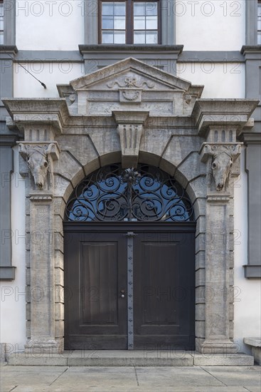 Cattle skull at the entrance portal of the Stadtmetzg, former slaughterhouse, today administration, Augsburg, Bavaria, Germany, Europe