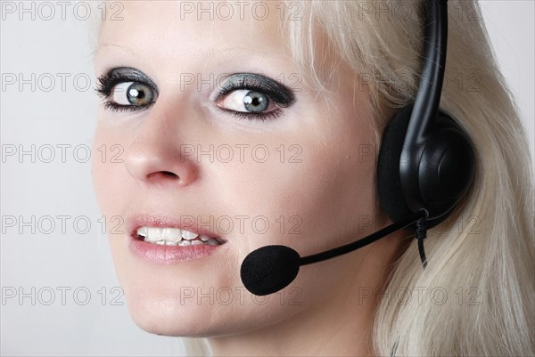 Portrait of young woman with headset