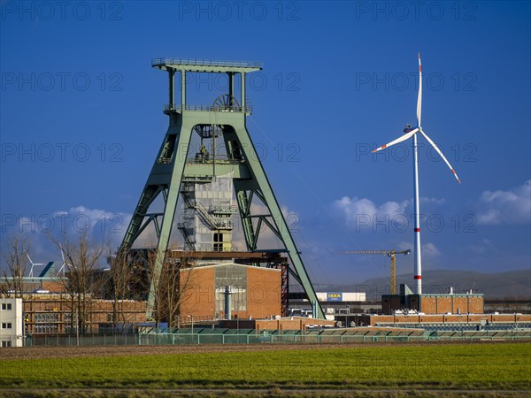 Former winding tower of Konrad shaft, wind turbine. The disused iron ore mine is being converted into a repository for low- and intermediate-level radioactive waste. Salzgitter, Lower Saxony, Germany, Europe