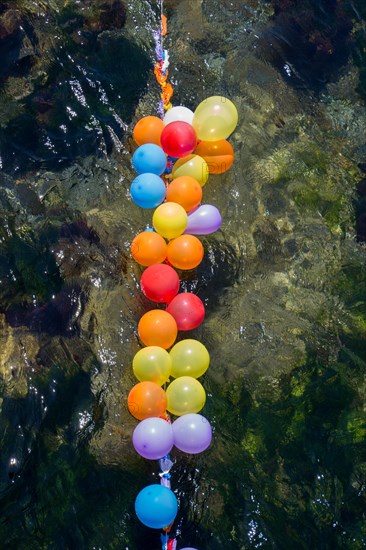 Balloons in shooting range as targets on water