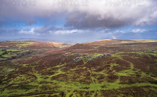 Rainbow over Emsworthy Mire from a drone, Haytor Rocks, Dartmoor National Park, Devon, England, UK