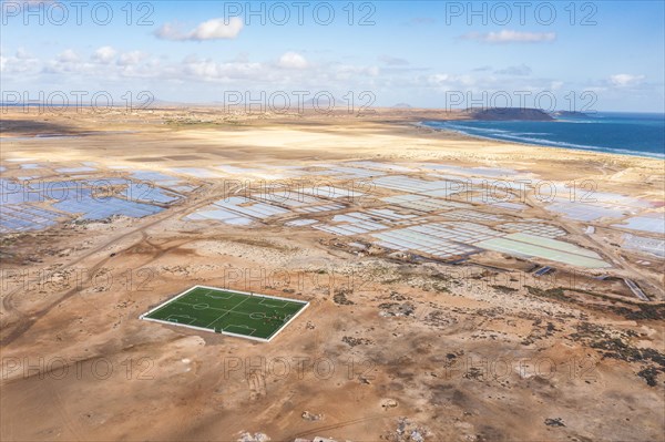 Landscape with ocean, salinas and sports field in Sal, Cape Verde Islands