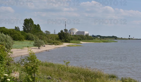 The decommissioned Brokdorf nuclear power plant on the beach of the Elbe, Schleswig-Holstein, Germany, Europe
