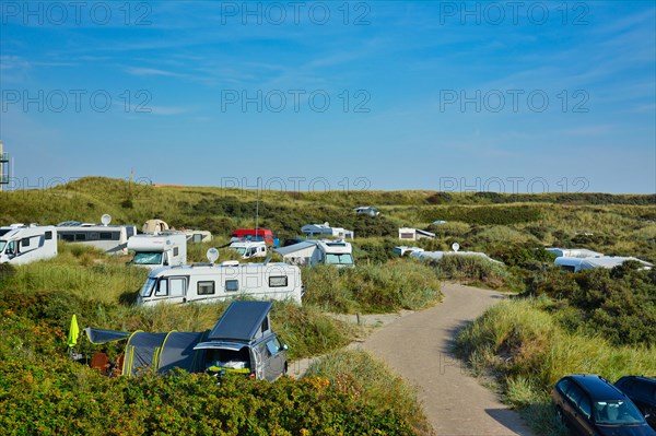 De Koog, Texel, Netherlands, August 2019: Camping site called Kogerstrand with big cars and camper vans in the dunes near beach on island Texel