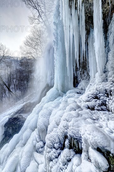 Icicles at the waterfall, permafrost with icy landscape, Swabian Alb, Bad Urach, Baden-Wuerttemberg, Germany, Europe