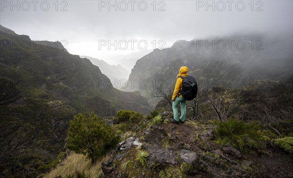 Hiker, Pico Arieiro to Pico Ruivo Hike, Rock Cliff Hiking Trail, Central Mountains of Madeira, Madeira, Portugal, Europe