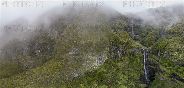 Aerial view, Lagoa do Vento with Upper Risco waterfall, forest and fog, Rabacal, Madeira, Portugal, Europe