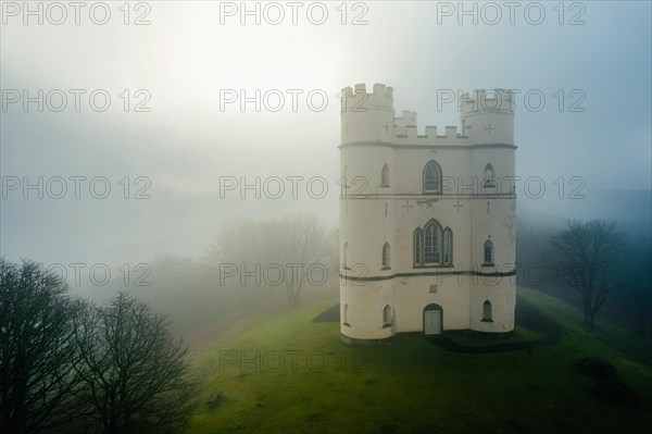 Misty morning over Haldon Belvedere from a drone, Lawrence Castle, Higher Ashton, Exeter, Devon, England, United Kingdom, Europe