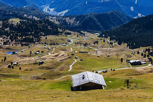 Autumnal alpine pastures and huts above San Cristina, Val Gardena, Dolomites, South Tyrol, Italy, Europe