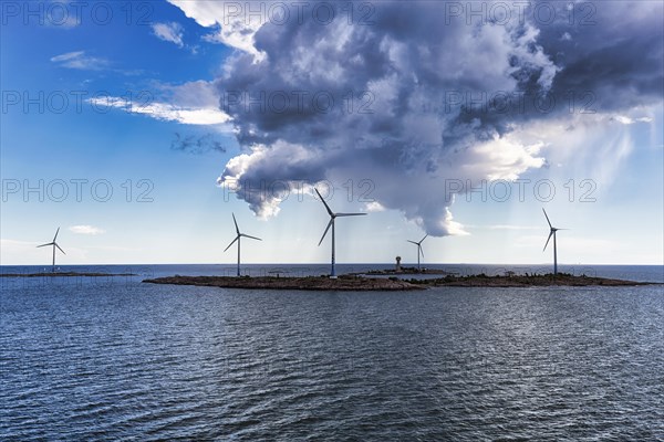 Wind turbines on small islands, Lilla Batskaer and Stora Batskaer, wind turbine, wind farm in the archipelago, Smart Energy Aland project, storm clouds, Mariehamn, Aland Islands, Gulf of Bothnia, Baltic Sea, Finland, Europe