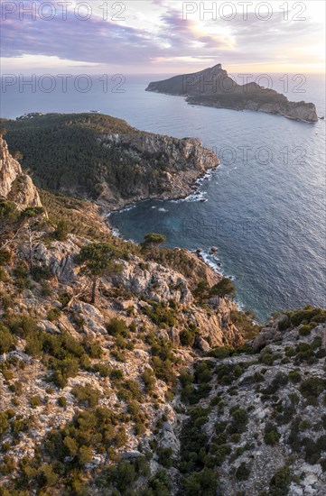 Rocky coast with an island, Sunset over the ocean, Mirador Jose Sastre, Sa Dragenora Island, Mallorca, Spain, Europe