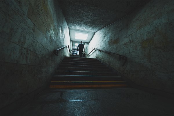 Silhouette of the man in underground tunnel