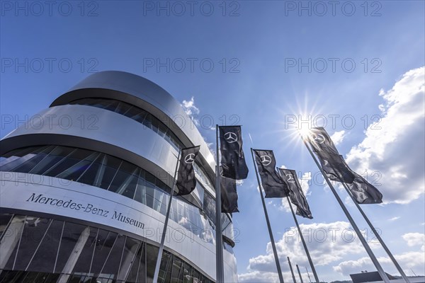 Mercedes Benz Museum with black flags with Mercedes star, exterior view, Stuttgart, Baden-Wuerttemberg, Germany, Europe