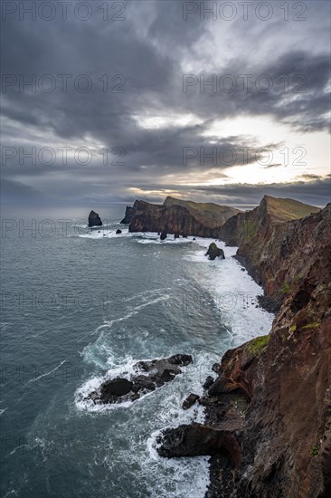 Red cliffs and rocks in the sea, coastal landscape, at sunset, Miradouro do Canical, Ponta de Sao Lourenco, volcanic peninsula of Sao Lourenco, Ponta de San Lorenzo, Madeira, Portugal, Europe