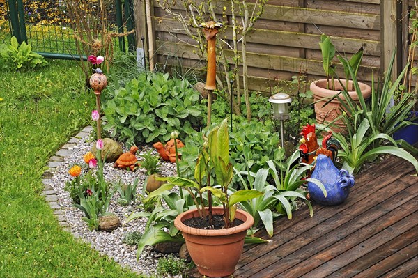 Garden corner with ceramic figures, Munich, Bavaria, Germany, Europe