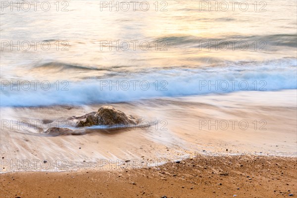 Wave crash on a sandy beach in the Atlantic Ocean. Sables dOlonne, Vendee, Pays-de-la-Loire, France, Europe