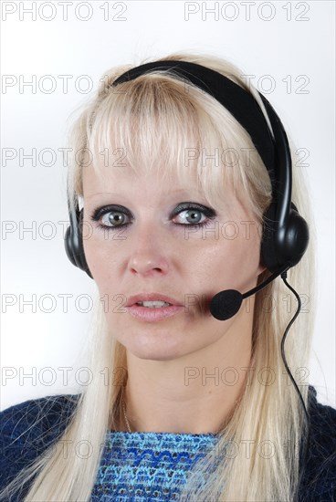 Portrait of young woman with headset