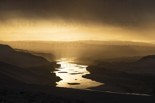 Thunderstorm over the Orange River, also known as the Orange River, on the border between Namibia and South Africa, Oranjemund, Sperrgebiet National Park, also known as Tsau ÇKhaeb National Park, Namibia, Africa