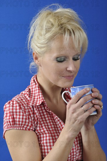 Woman drinking a hot drink