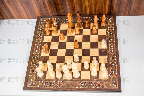 Chess board with chess wooden pieces