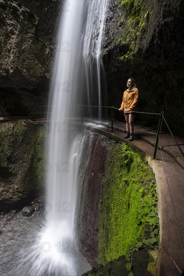 Hiker at Levada do Moinho, Waterfall in a gorge, Ponta do Sol, Madeira, Portugal, Europe