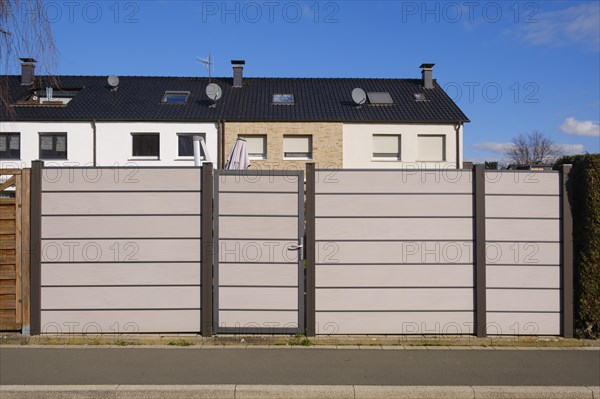 Modern fence in front of terraced house, WPC privacy fence, North Rhine-Westphalia, Germany, Europe