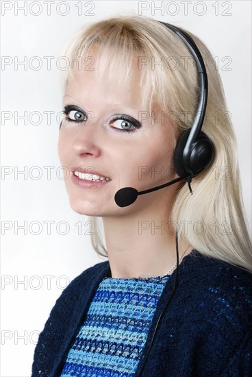 Portrait of young woman with headset