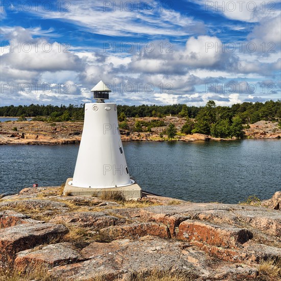 Coastline with lighthouse on rocks, sunny weather, Kaeringsund, Fasta Aland, Aland Islands, Aland Islands, Finland, Europe