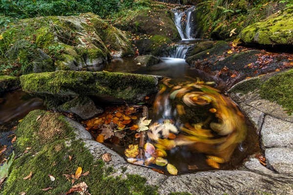 Waterfall falling over Mossy Rocks in the Vosges Mountains. Alsace, France, Europe