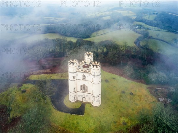 Misty morning over Haldon Belvedere from a drone, Lawrence Castle, Higher Ashton, Exeter, Devon, England, United Kingdom, Europe