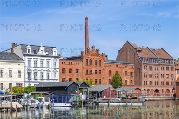Boathouses, residential buildings and industrial architecture on Muehlendamm, Brandenburg an der Havel, Brandenburg, Germany, Europe